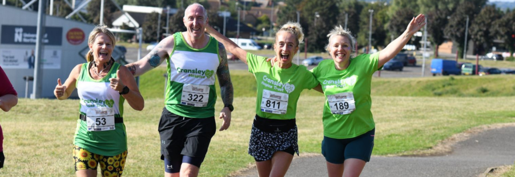 Four people running/