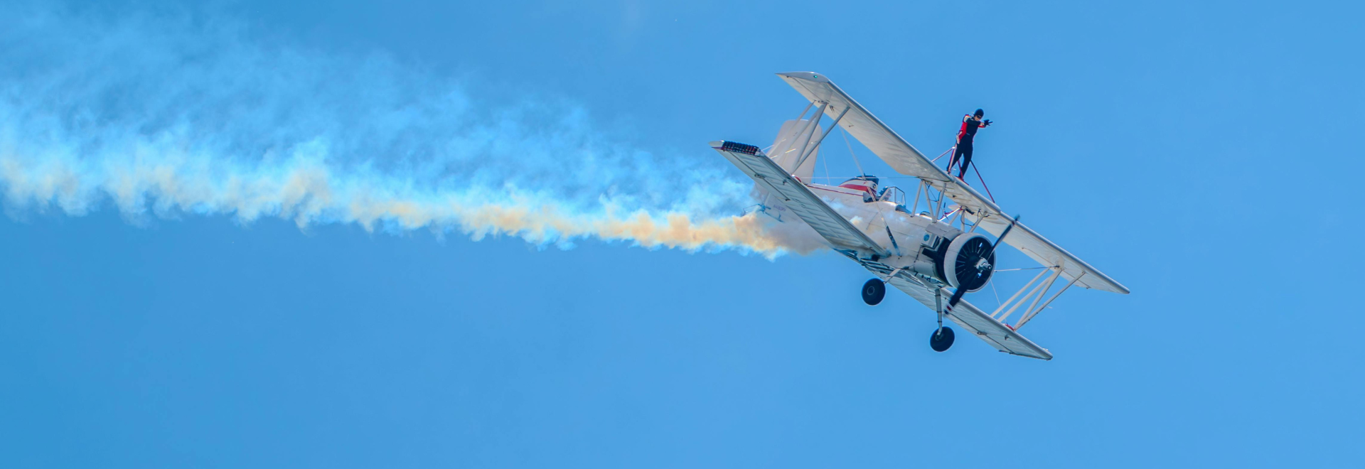 Stuntman performing wing walk.